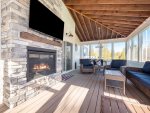 Deja Blue`s screened-in porch might become your favorite spot in the house. Watch TV and enjoy the gas fireplace in the evening air